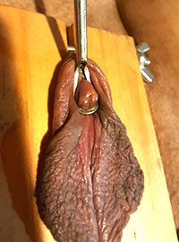 Clitoris was tied up tortured nailed pierced and cut off